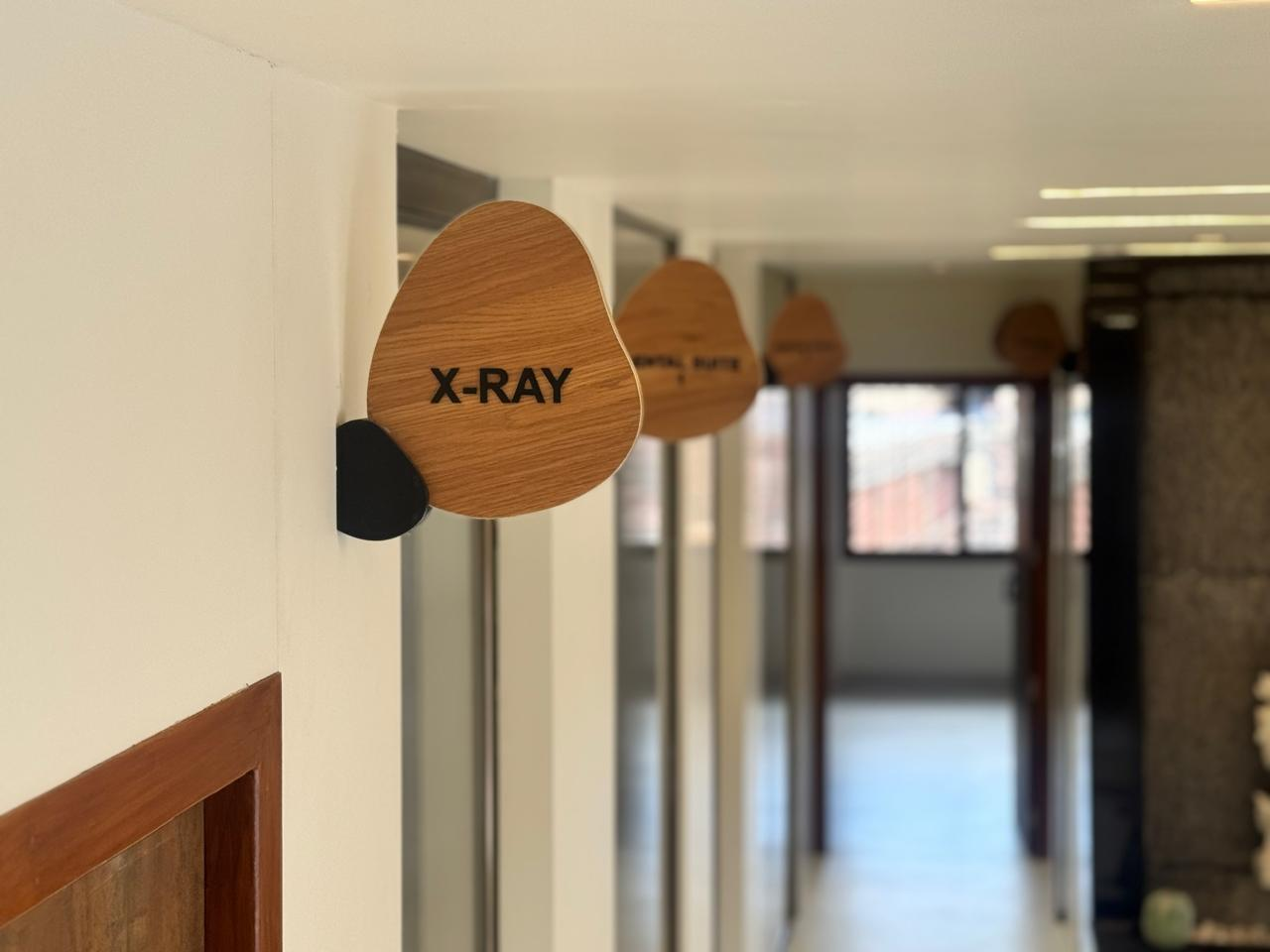 Wooden X-ray room sign inside iDental